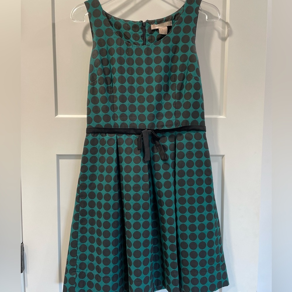 Turquoise dress with black polkadots and silk bow.